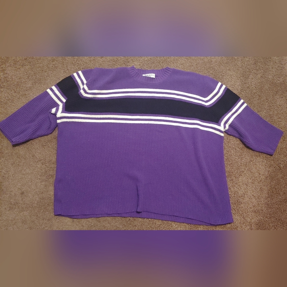 3X J.E. Sportswear Inc.  Purple with white and black strips to chest and sleeve.